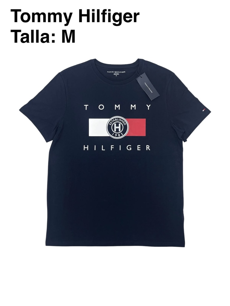 Playera Tommy Hilfiger azul marino con un logotipo gráfico circular en el centro talla m