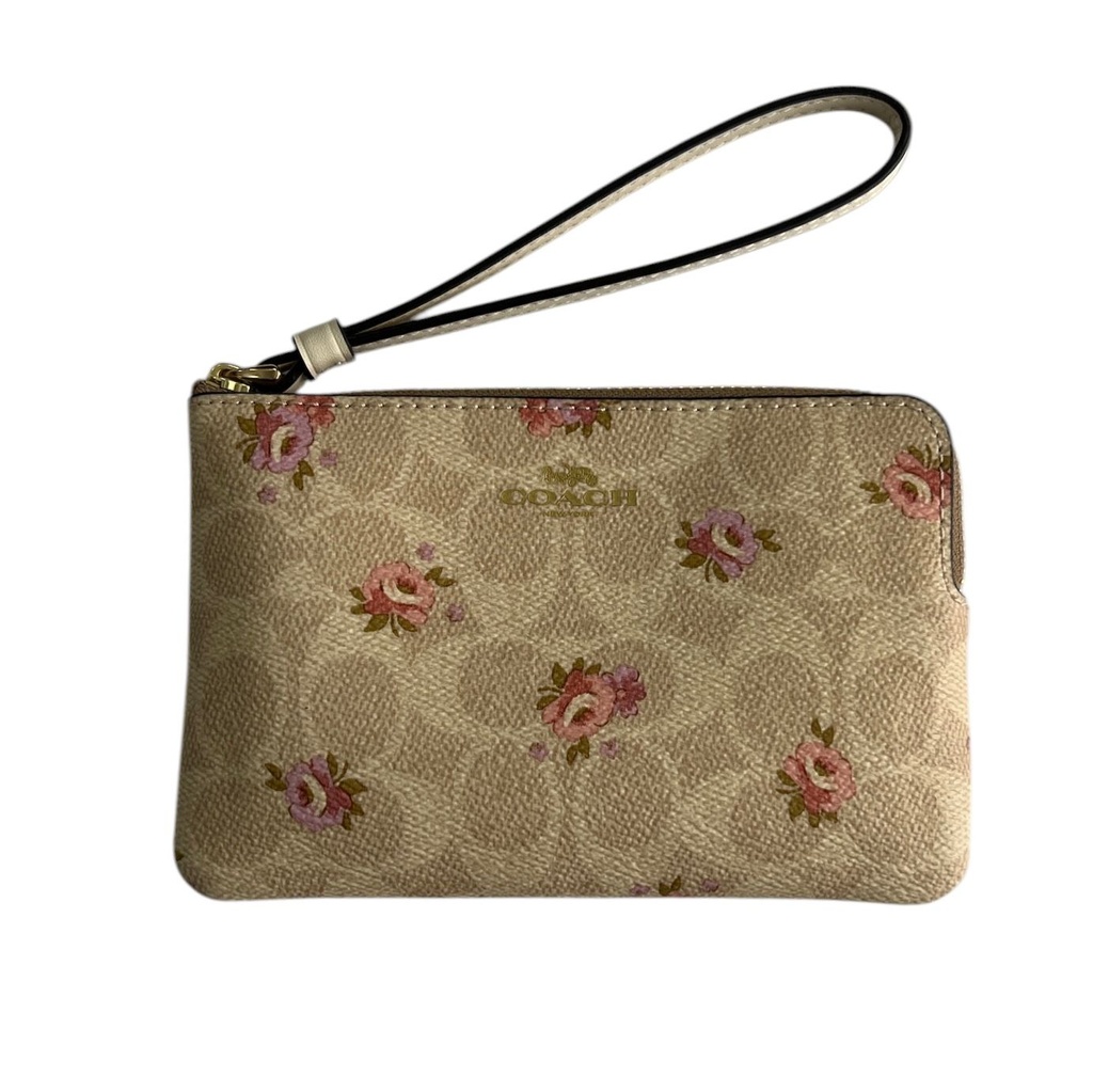Muñequera de dama Coach con estampado floral